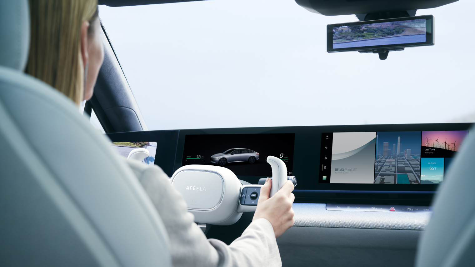 A sample image of a person taking a drive with AFEELA.